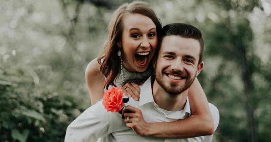 A photo of a couple smiling at the camera