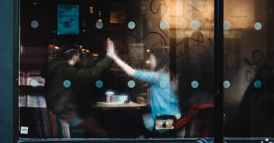 A photo of a man and a woman in a cafe