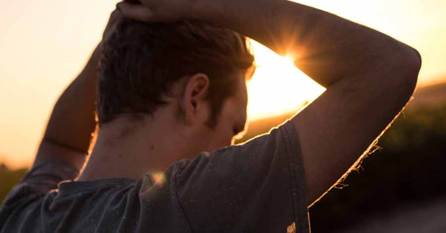 A photo of a man against the sunlight