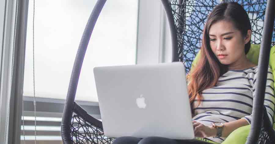 A woman using a laptop 